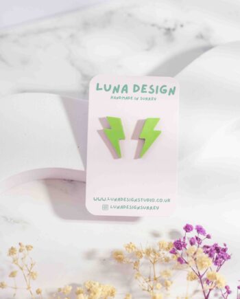 Lime green lightning bolt stud earrings with a glossy patent finish