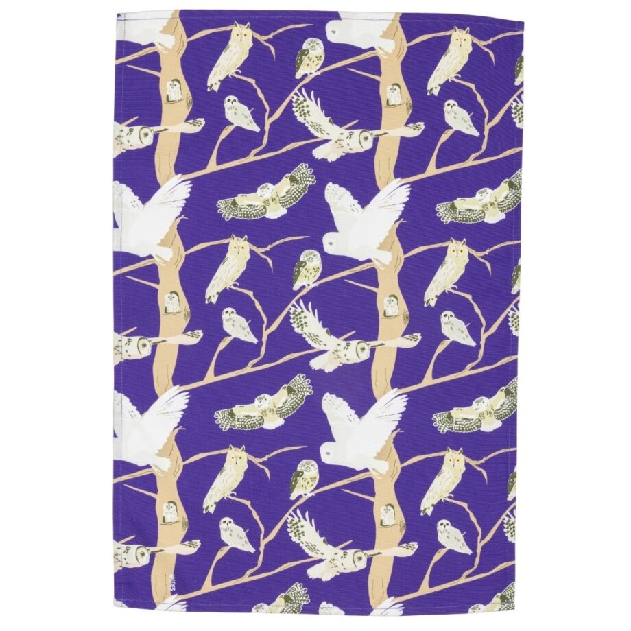 purple cotton kitchen cloth with owl illustrations shown laid out flat on a white background