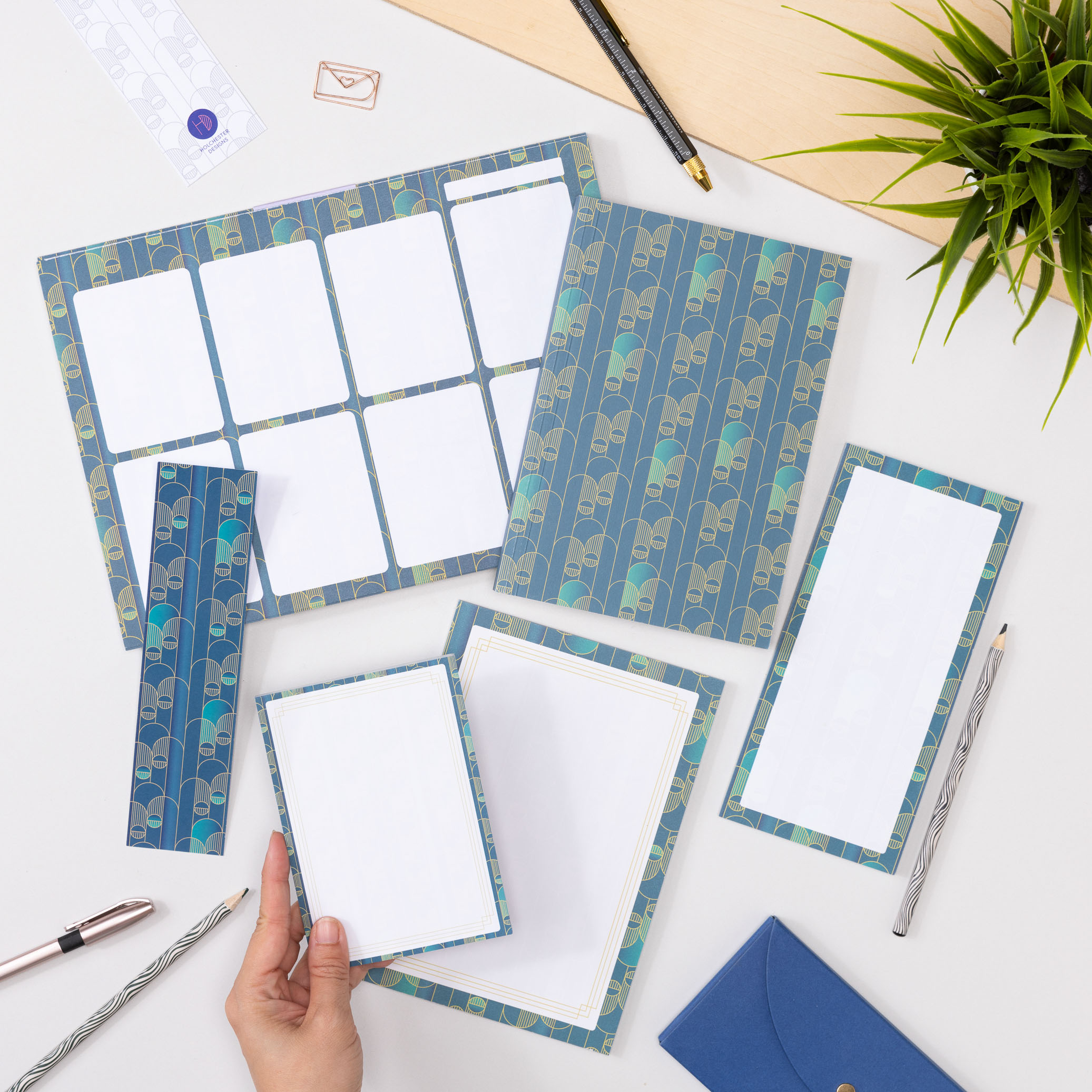 Full Deco Delights stationery range lying flat on a white desk top.
