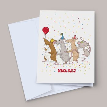 A congratulations greeting card showing four illustrated rats in party hats and gold crowns dancing in a conga line, surrounded by colourful confetti. One rat holds a red polka-dot balloon. Bold red text reads CONGA-RATS! Card shown with a pale white envelope on a warm grey background.